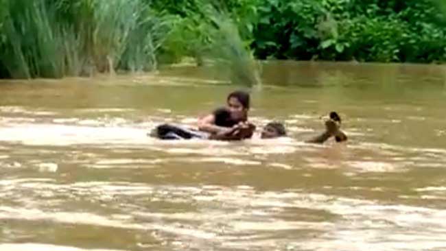 Andhra woman wades through river to write exam