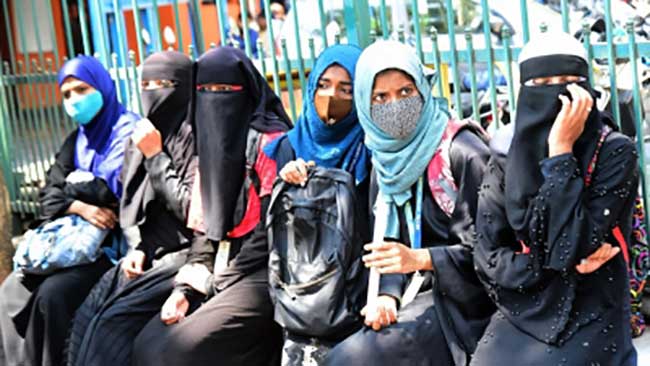 K'taka hijab politics back on frontburner; Cong to lift ban, BJP warns of strife