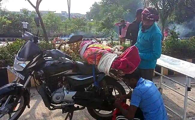 Denied hearse, MP man takes mother's body on bike for cremation